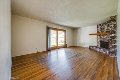 Sliding glass doors lead to the beautiful back yard.