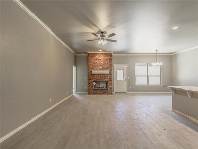 Unfurnished living room with baseboards, wood-type