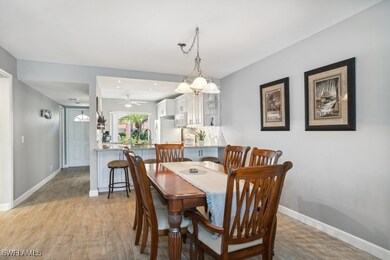 Dining space with notable chandelier and light woo