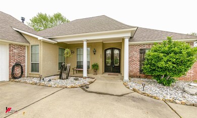Entrance to property featuring a porch