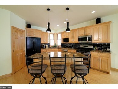 Maple cabinets, granite tops, tile backsplash, har