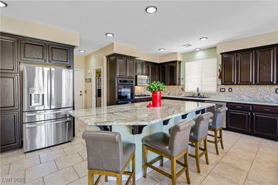 Kitchen with a breakfast bar area, a kitchen islan