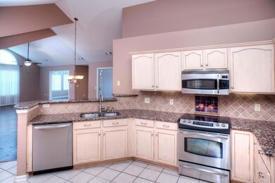 Granite Counters and Breakfast Bar in Kitchen