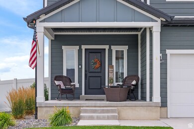 Property entrance with a porch and board and batten siding