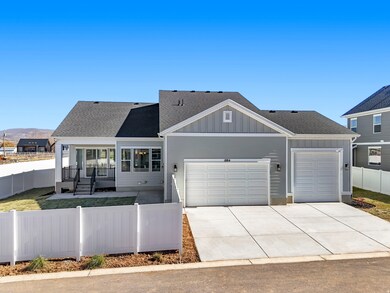 View of front of home featuring a fenced front yard, a shingled roof, board and batten siding, and concrete driveway