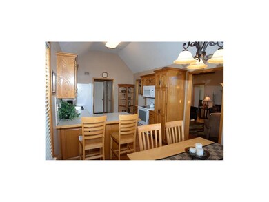 Kitchen showing doorway leading to laundry, half b