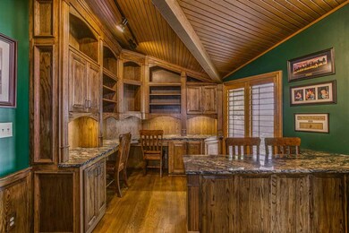 Note the custom cabinetry and the beautiful wood c