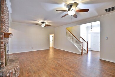 Grand living room separates master bedroom from tw