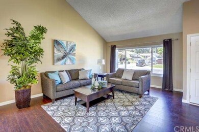 Spacious formal living room with volume ceilings a