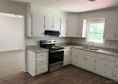 Kitchen featuring stainless steel electric range o
