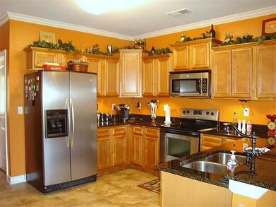 Spacious kitchen w/lots of custom cabinetry, all stainless appliances plus 2 big pantries.