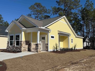Craftsman house with covered porch and a shingled 