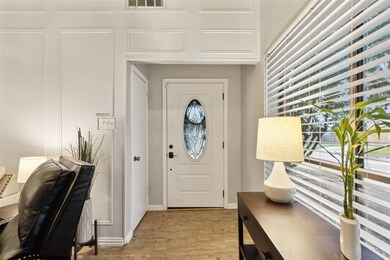 Foyer with light hardwood / wood-style flooring