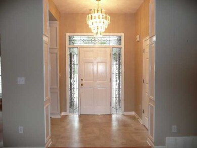 Lovely light filled foyer has new flooring & stunn