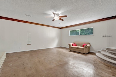 Living area with ceiling fan, ornamental molding, 