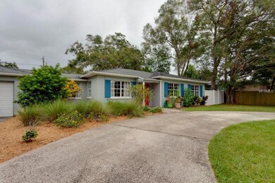 Pretty little cottage with nice landscaping out front.