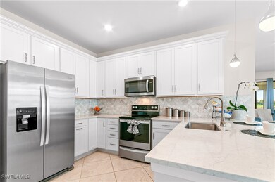 Kitchen with appliances with stainless steel finis