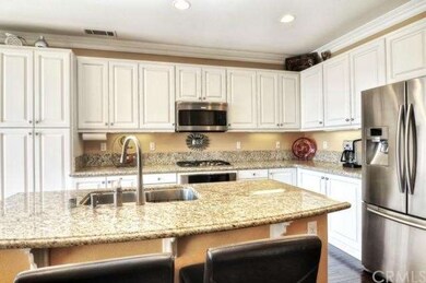 Beautiful bright white cabinetry with a place for 