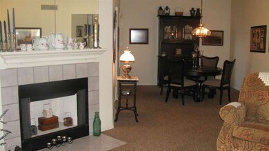 view of fireplace and formal dining