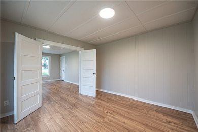 Unfurnished room featuring light wood-type floorin