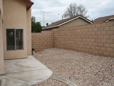 back side yard with extended concrete for storage,