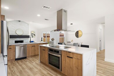 Kitchen with stainless steel appliances, modern c
