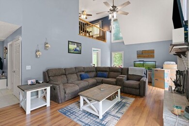 Large family room with vaulted ceilings and firepl