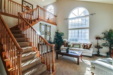 Another view of the living room with the staircase