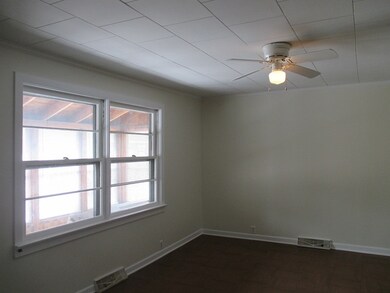 Living Room Overlooks Enclosed Porch Area