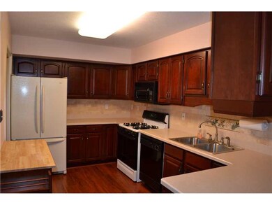 Kitchen. Beautiful cherry cabinets with corian cou
