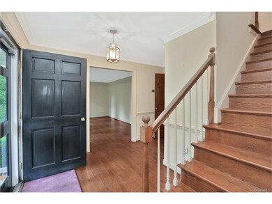 The Foyer has chair railing, wood floor, closet wi