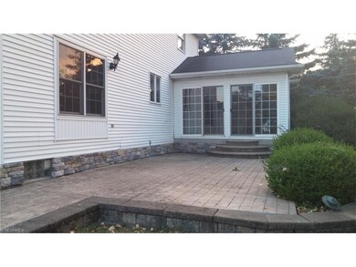 Three season room, large patio and yard make large