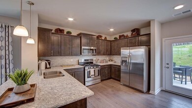 Granite and LOTS of cabinets in kitchen.  Photo of