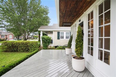 Large front porch with pecky cypress cover