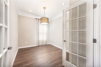 This den is a fabulous home office or it could be a play room or third bedroom.