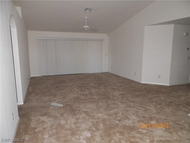 Livingroom with sliders to covered lanai. 2nd & 3r
