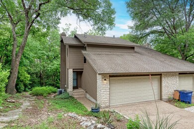 View of front of property with roof with shingles