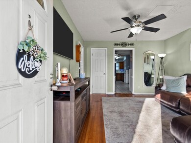 Step into comfort with this sunlit living space, b