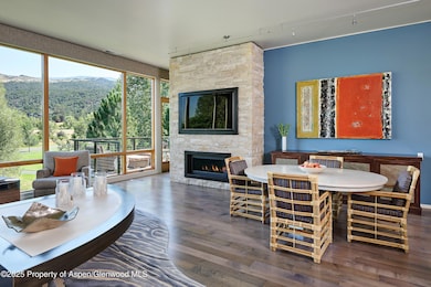 Dining Area with custom stone fireplace