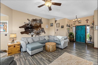 Living room featuring dark wood-type flooring and 