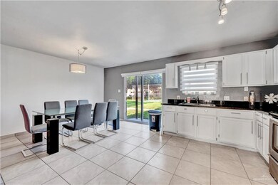 Dining space featuring light tile patterned floors