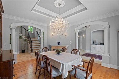 Stunning crystal chandelier highlights the room