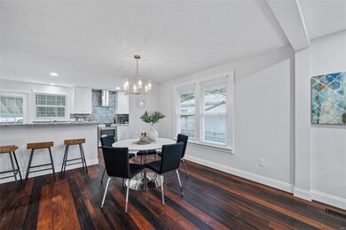 Breakfast room opens to living room and kitchen.