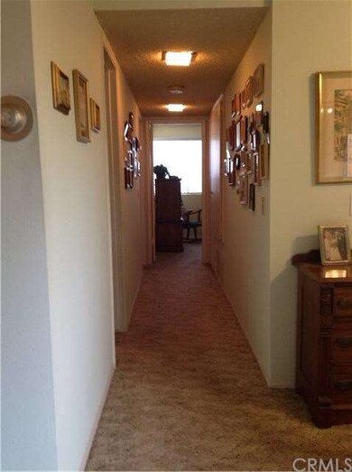 From living room, looking down hall towards bedroo