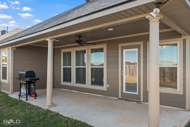 View of patio / terrace featuring area for grilling and ceiling fan
