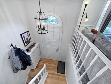 Foyer with wood floor.