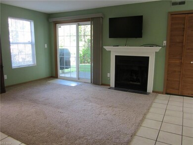 Unfurnished living room featuring light tile floor