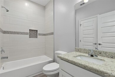 Bathroom featuring vanity and bathing tub / shower combination