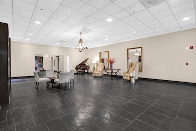 Community lobby with recessed lighting and a drop ceiling