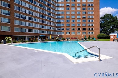 Community pool with a patio area